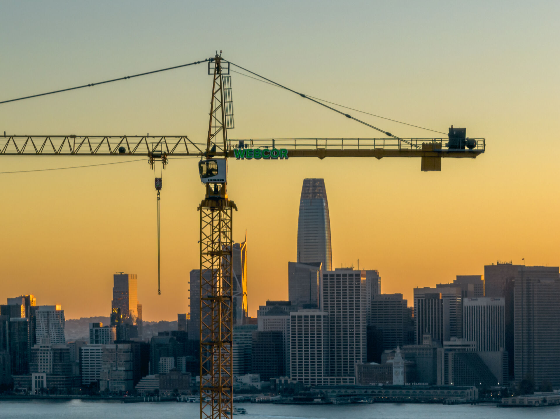 Aerial view of a construction crane over an active worksite